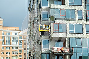 Surveying Large Building Site. Workers Building New House, install Windows, Wall Insulation, Balcony. Industrial Building Constru