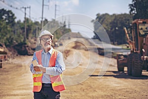 Surveyor builder Engineer technician  Business Team discuss plan at new construction site