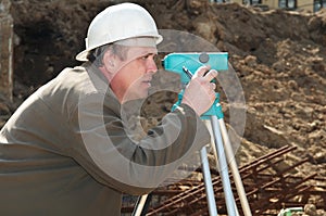 Surveyor at construction work