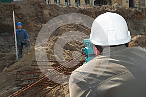 Surveyor at construction work