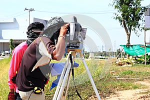 Surveyor engineer making measuring