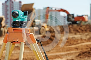 Surveyor equipment level outdoors at construction site
