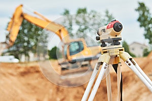 Surveyor equipment level outdoors at construction site