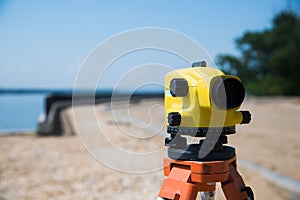 Surveyor equipment tacheometer or theodolite outdoors at construction site