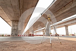 Surveyor equipment. theodolite for Civil Engineers at road construction site. Highway