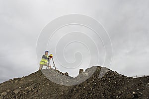 Surveyor Using Theodolite At Site photo