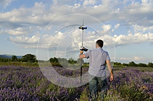 Surveyor walking in a lavender field