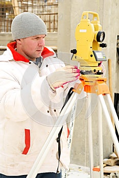 Surveyor worker at construction