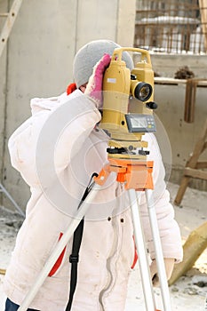 Surveyor worker at construction