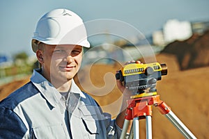 Surveyor worker with level