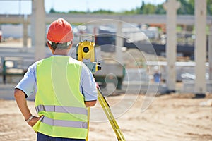 Surveyor worker with theodolite