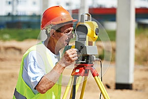 Surveyor worker with theodolite