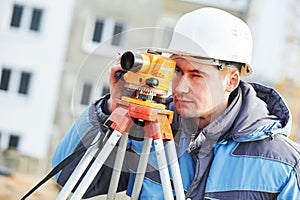 Surveyor workier with level