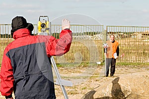 Surveyor works with theodolite