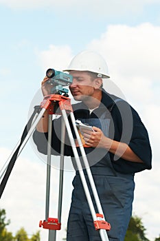 Surveyor works with theodolite