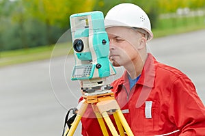 Surveyor works with theodolite