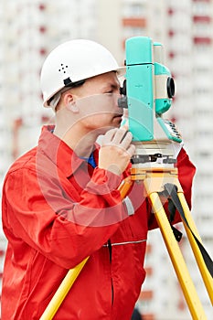 Surveyor works with theodolite