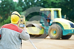 Surveyor works with theodolite