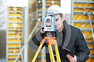 Surveyor works with theodolite