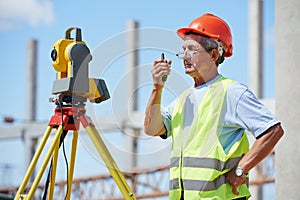 Surveyor works with theodolite