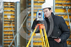 Surveyor works with theodolite