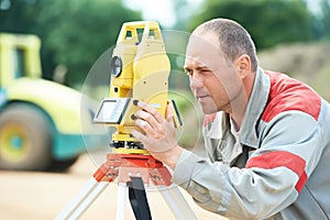 Surveyor works with theodolite