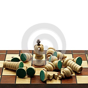 Survival Concept: White King Chess Piece With Defeated Chess Pieces