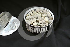 Survival kit conceptual image representing pills and medicine that can save our lives in front of and diseases