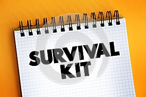 Survival Kit text on notepad, concept background