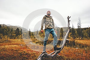 Survival man traveler in forest swamp landscape