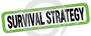 SURVIVAL STRATEGY text written on green-black rectangle stamp