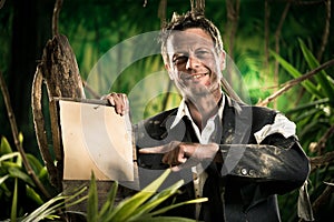 Survivor businessman pointing at sign