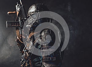 Survivor with custom armour and gun in dark background