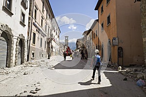 Survivors and emergency workers in earthquake damage, Amatrice, Italy photo