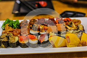 Sushi is arranged on a plate in a Japanese restaurant.