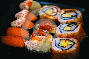 Sushi is arranged on a plate in a Japanese restaurant.