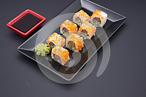 Sushi Arrangement with Soy Sauce and Wasabi