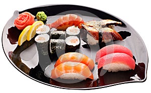 Sushi on the black plate. Traditional japanese food.