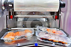 Sushi in boxes transfer on automated conveyor system