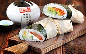 Sushi Burrito with salmon, cucumber, pepper and cream cheese