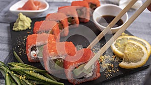 Sushi with caviar on torrets, soy, wasabi, ginger and garnish