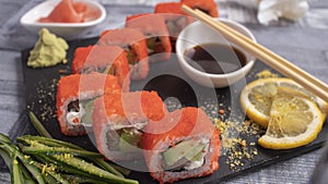 Sushi with caviar on torrets, soy, wasabi, ginger and garnish photo