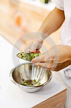 Sushi chef grating fresh Wasabi, Fresh wasabi root prepare for n