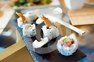 Sushi and chopsticks. Food detail concept.