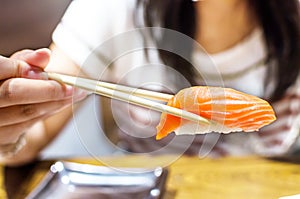 Sushi with chopsticks