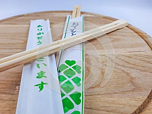 Sushi chopsticks on wooden plate Decorative cutlery set