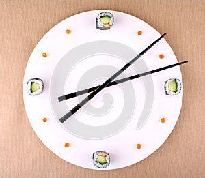 Sushi clock, time concept with caviar on a white plate