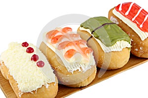 Sushi Donuts in the bamboo dish on white background.