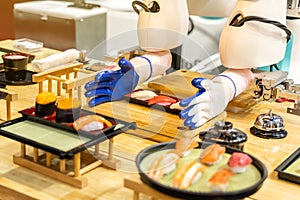 Sushi maker robots are serving food in future genius restaurants photo