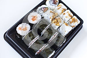 Sushi maki and crispy rolls on the plate